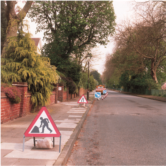 Cones and directional signs set up on road